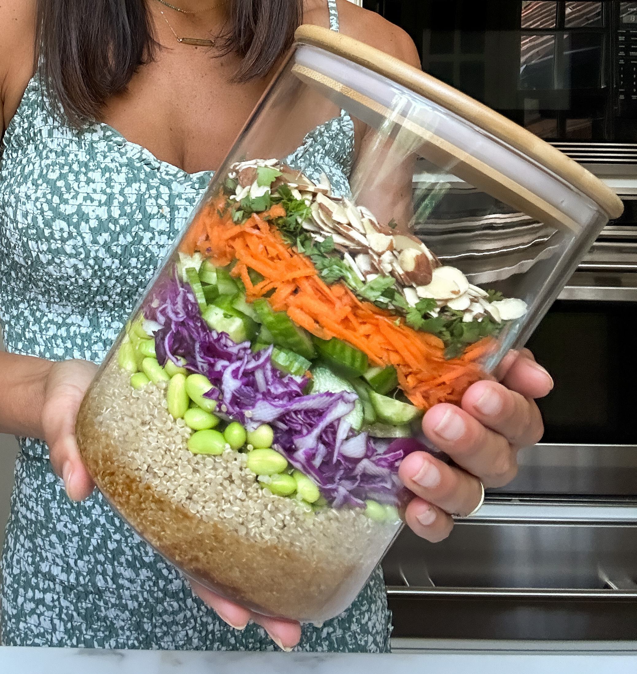 jackie akerberg holding her popular layered canister salad
